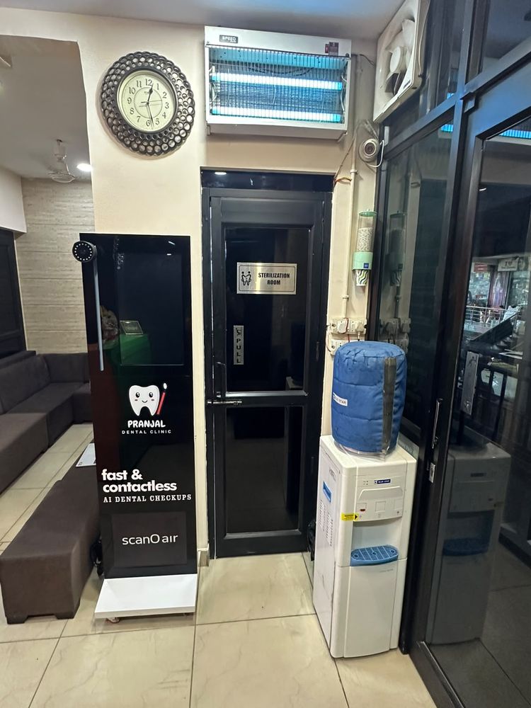 Sterilization room door and AI dental check-up kiosk at Pranjal Dental Clinic