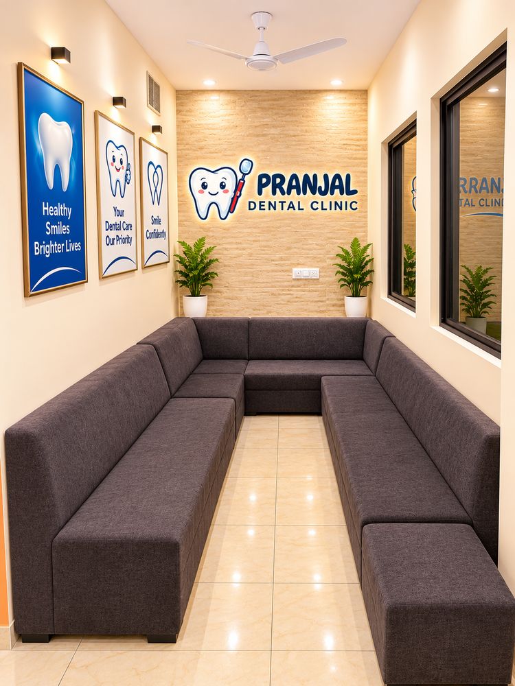 Waiting area with sofas at Pranjal Dental Clinic